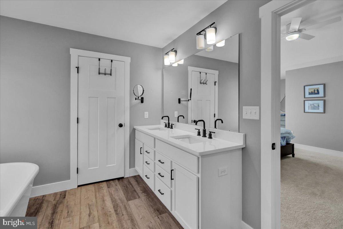 1057 Ryebrook Road Reading, PA 19608 - Photo 25 of 49 a spacious bathroom with a double vanity sink and mirror