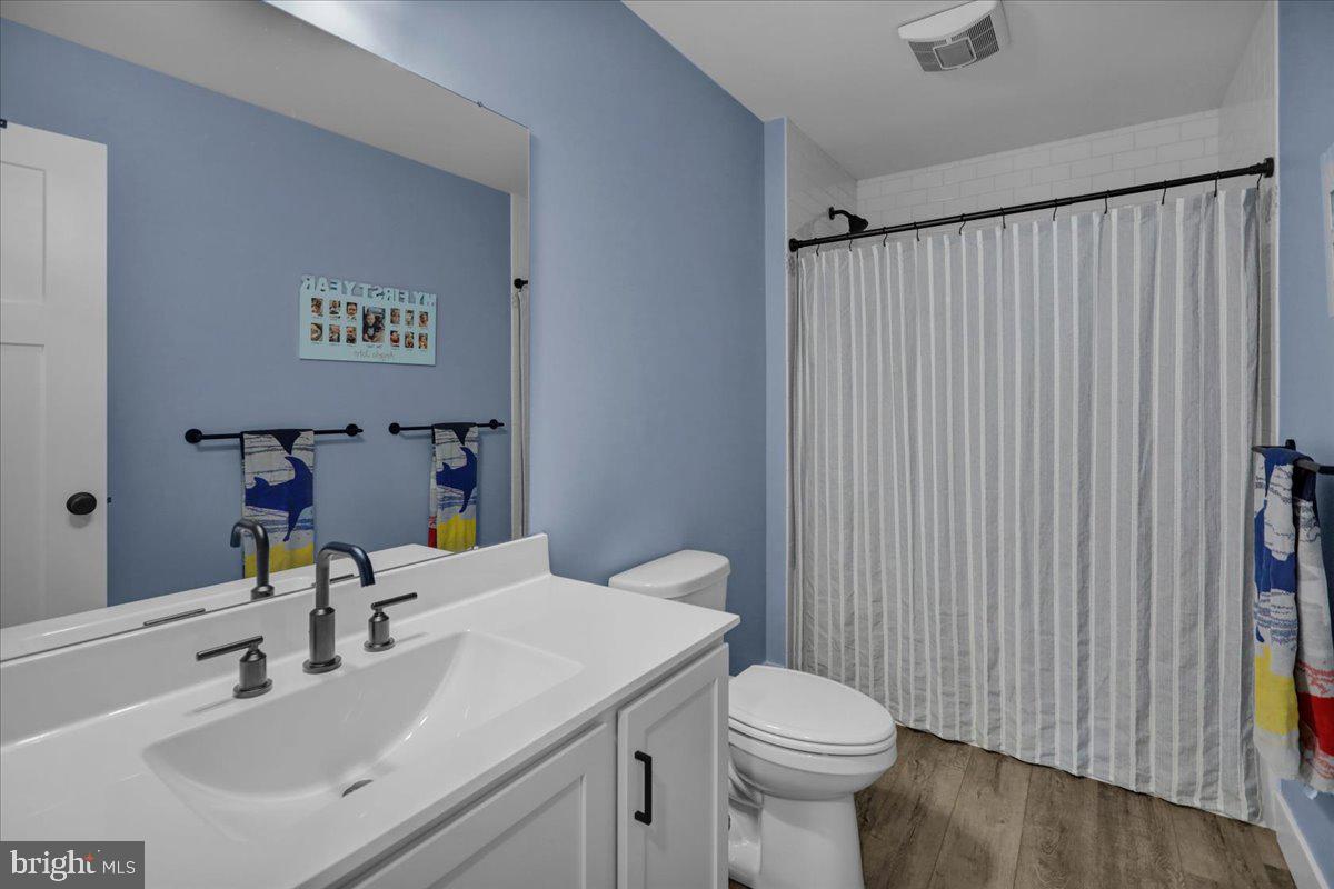 1057 Ryebrook Road Reading, PA 19608 - Photo 29 of 49 a bathroom with a sink a toilet and a mirror