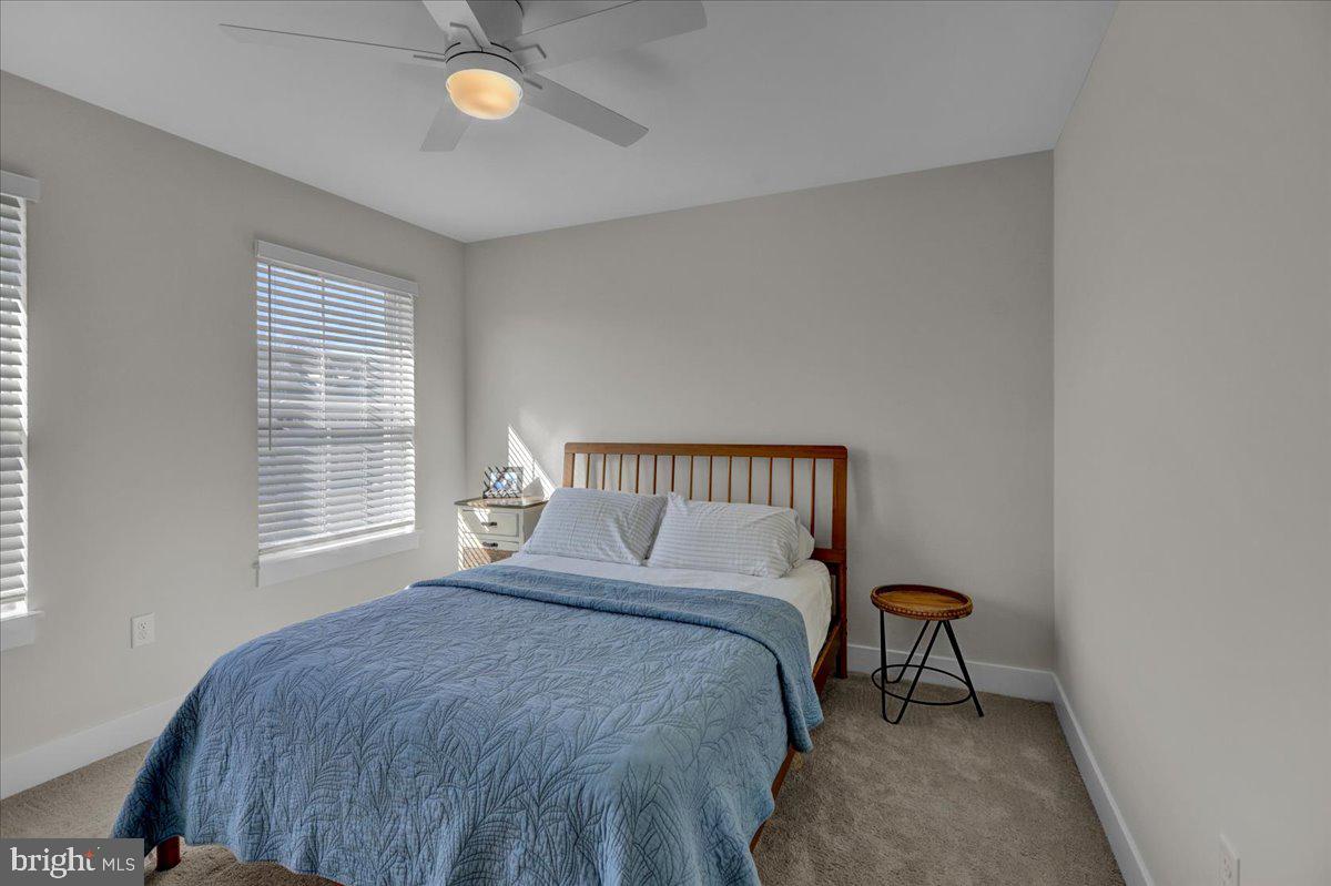 1057 Ryebrook Road Reading, PA 19608 - Photo 30 of 49 a bedroom with a bed and a lamp next to a window
