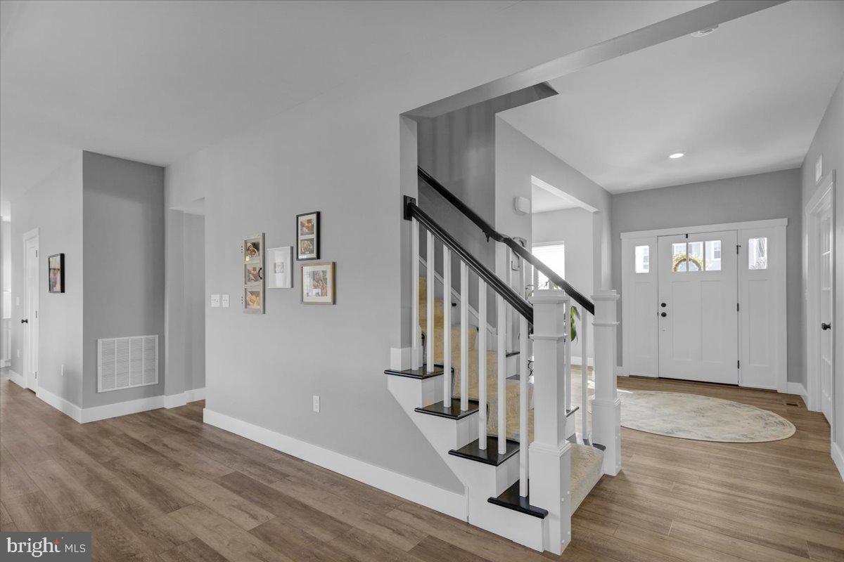 1057 Ryebrook Road Reading, PA 19608 - Photo 3 of 49 a view of entryway with wooden floor and stairs