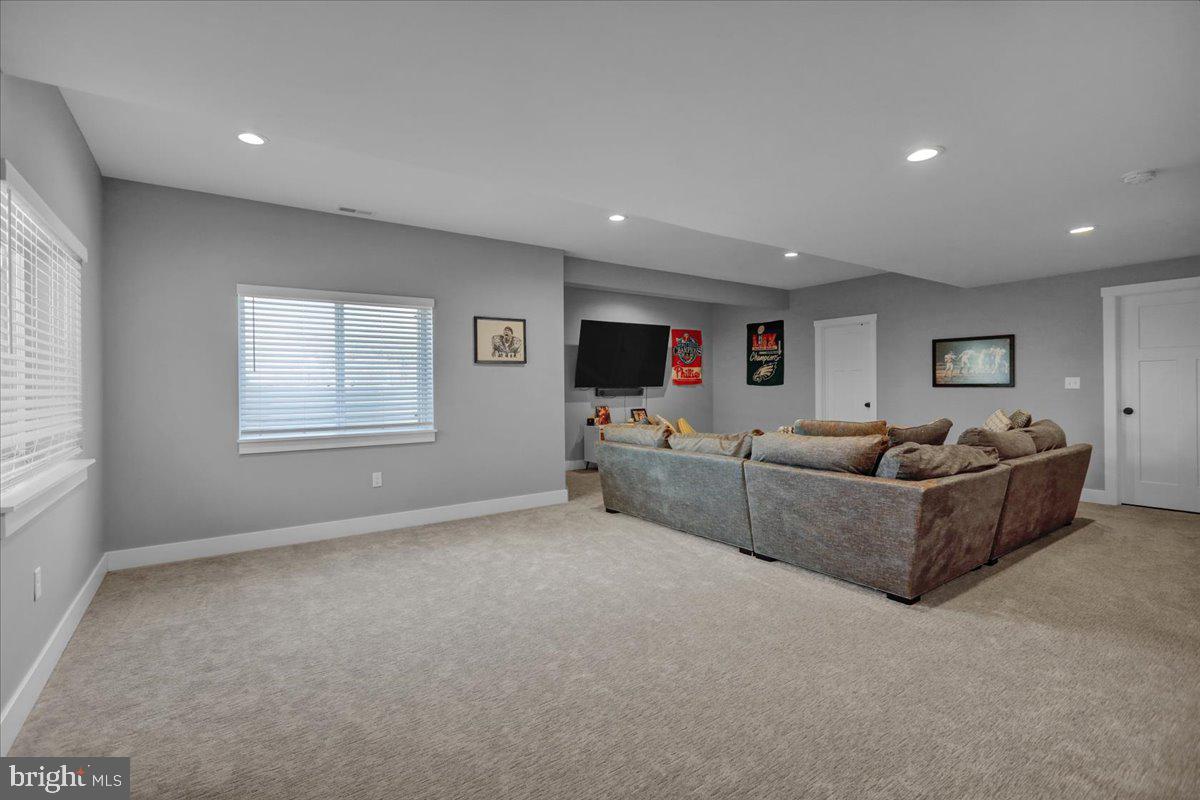 1057 Ryebrook Road Reading, PA 19608 - Photo 36 of 49 a living room with furniture and a flat screen tv