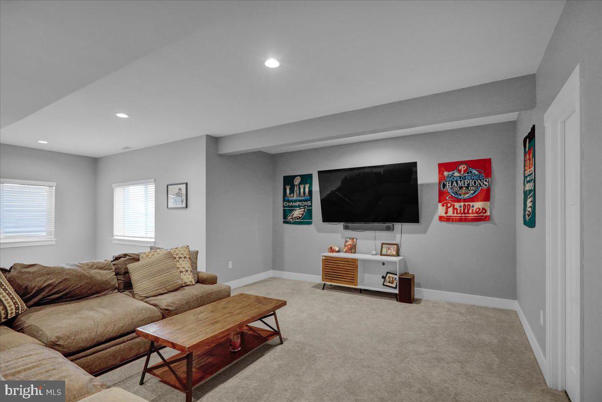 1057 Ryebrook Road Reading, PA 19608 - Photo 38 of 49 a living room with furniture and a flat screen tv