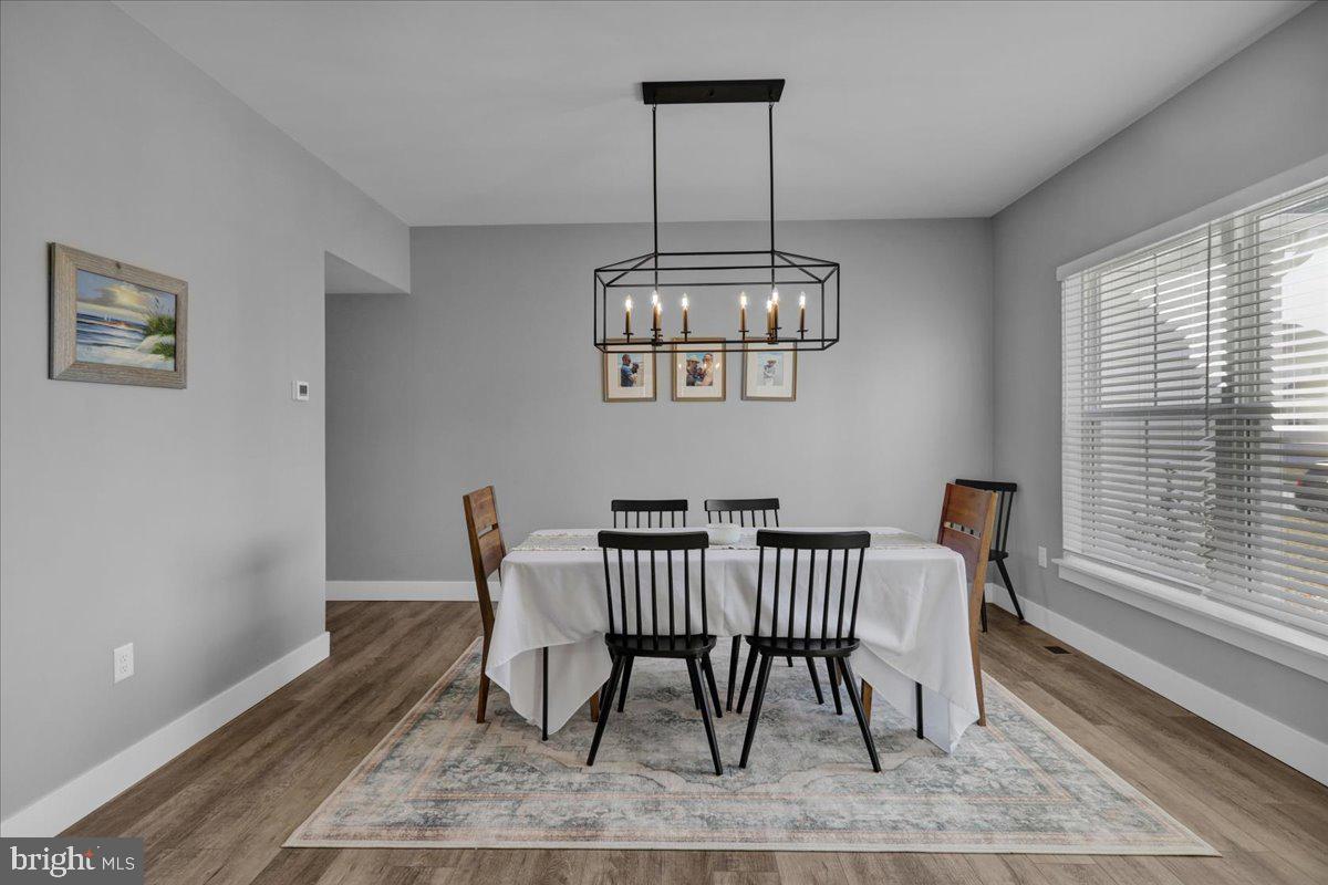 1057 Ryebrook Road Reading, PA 19608 - Photo 5 of 49 a view of a dining room with furniture window and wooden floor