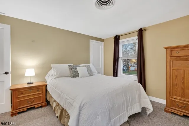 a bedroom with a bed and a cabinets