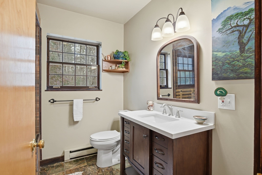 359 Montague Road Shutesbury, MA 01072 - Photo 14 of 38 a bathroom with a sink and a mirror