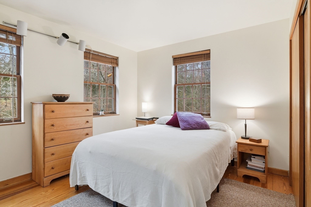 359 Montague Road Shutesbury, MA 01072 - Photo 25 of 38 a bedroom with a bed and a closet