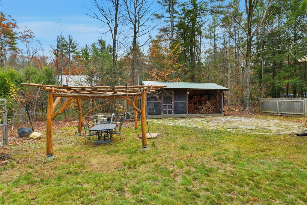359 Montague Road Shutesbury, MA 01072 - Photo 34 of 38 a view of a swimming pool with a table and chairs