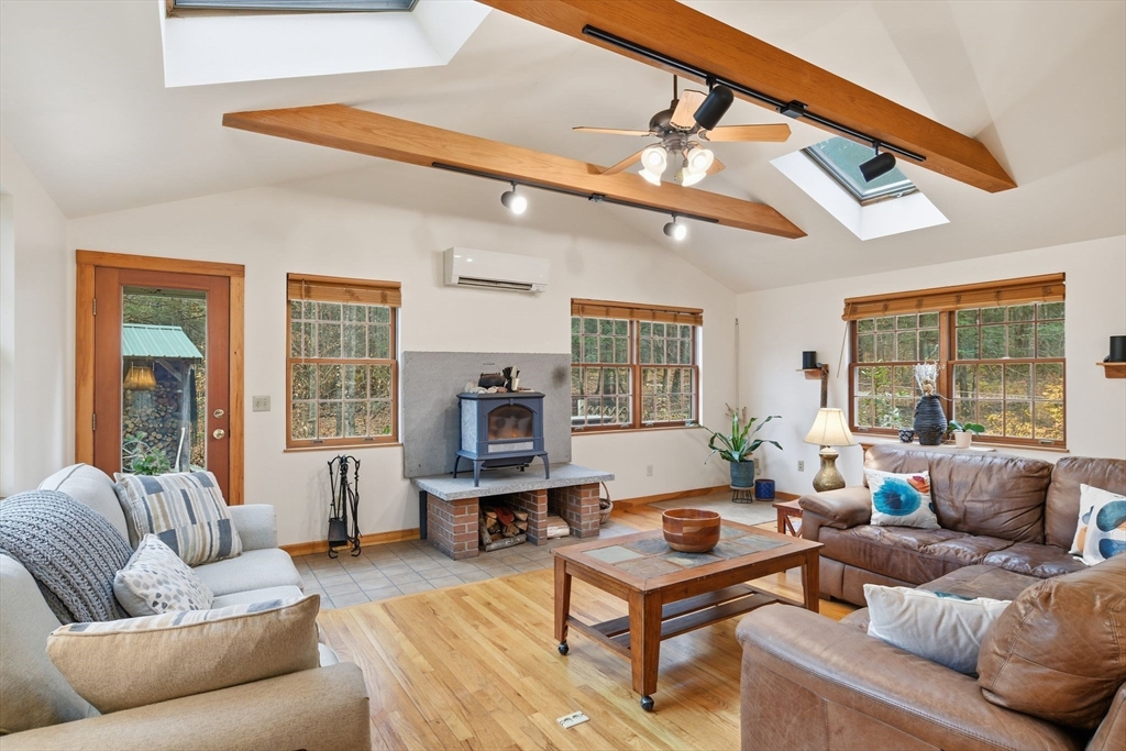359 Montague Road Shutesbury, MA 01072 - Photo 4 of 38 a living room with furniture and a large window