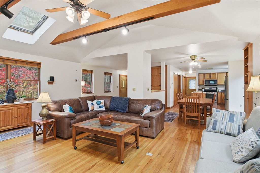 359 Montague Road Shutesbury, MA 01072 - Photo 5 of 38 a living room with furniture and a wooden floor