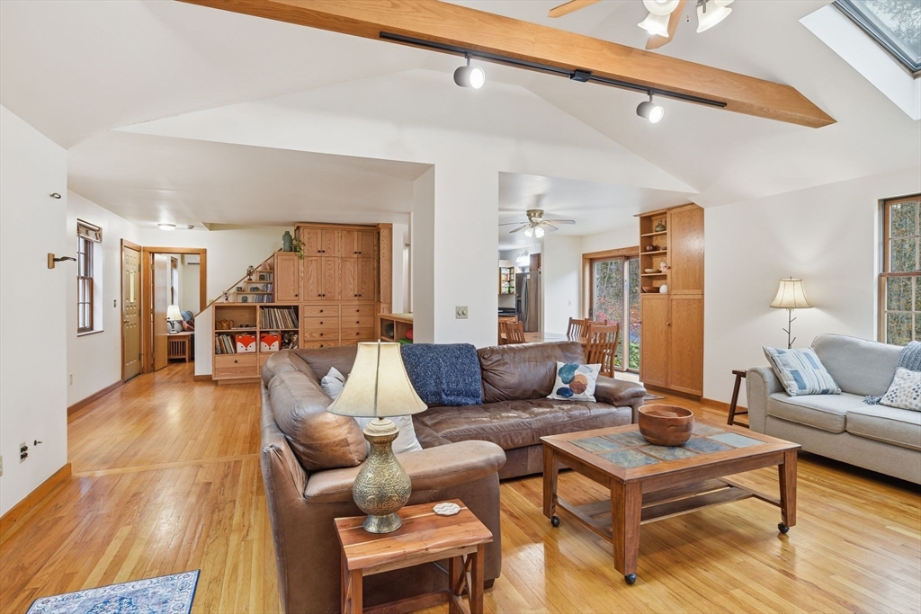 359 Montague Road Shutesbury, MA 01072 - Photo 6 of 38 a living room with furniture and a wooden floor