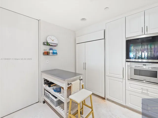 a room with cabinets and a wooden floor
