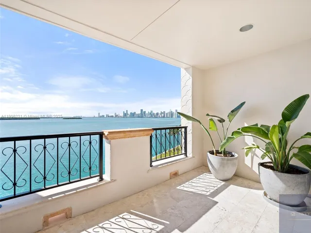 a view of a porch with furniture and garden