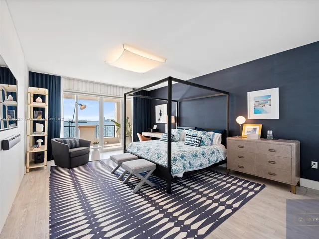 a bedroom with furniture and wooden floor