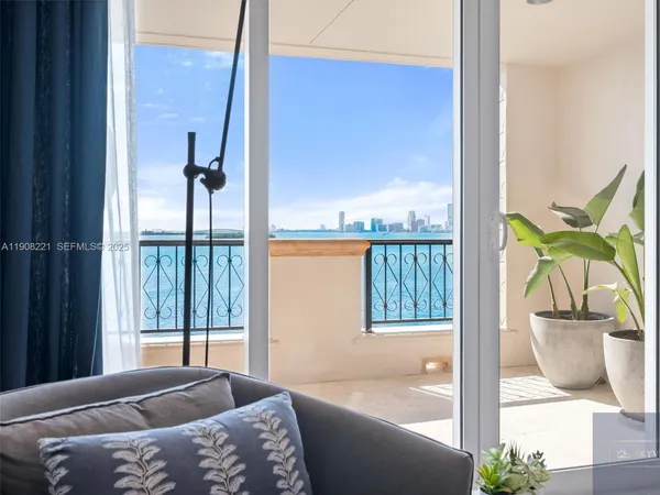 a bedroom with a bed and glass door