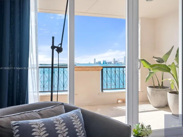 a bedroom with a bed and glass door