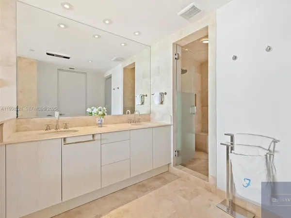 a bathroom with a double vanity sink mirror and double