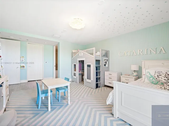 a bedroom with furniture and wooden floor