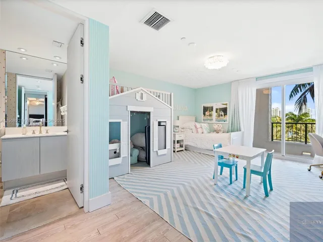 a living room with furniture a fireplace and a table