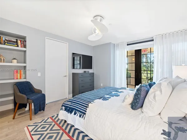 a bedroom with a bed furniture and a window