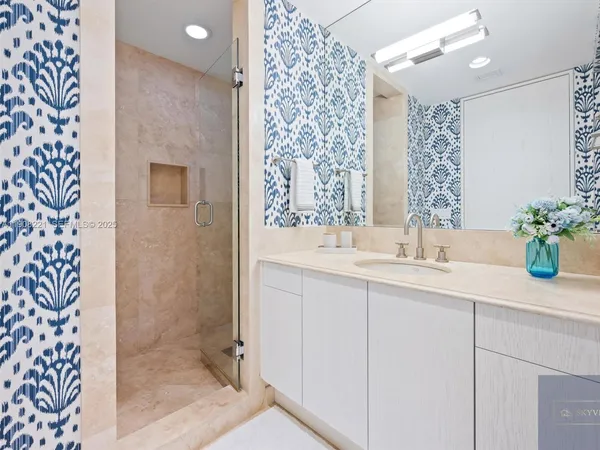 a bathroom with a sink and a shower