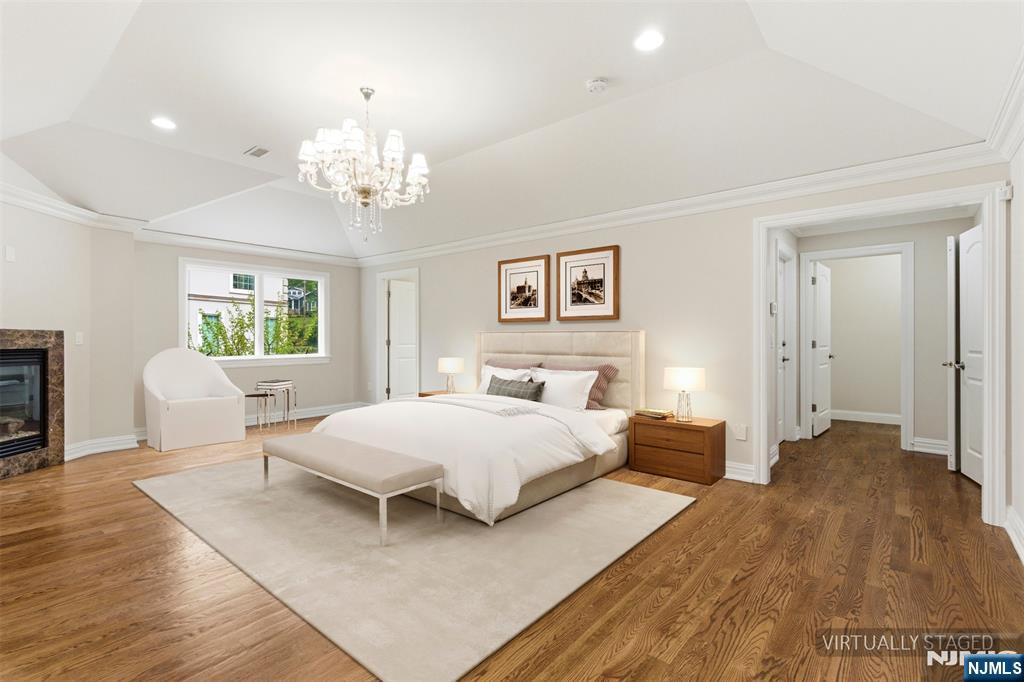767 Orangeburgh Road River Vale, NJ 07675 - Photo 31 of 49 a bedroom with a bed and a chandelier