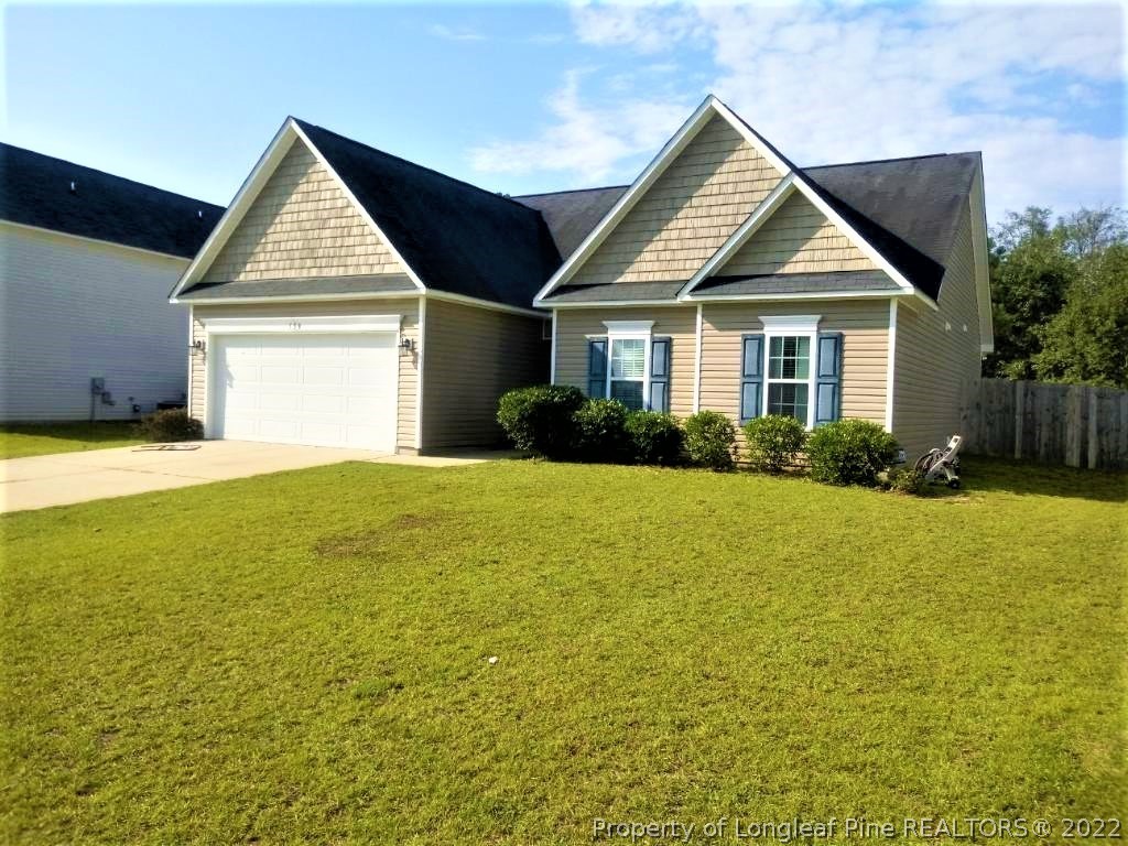 558 Cape Fear Road Raeford, NC 28376 - Photo 1 of 10 a front view of a house with yard and green space