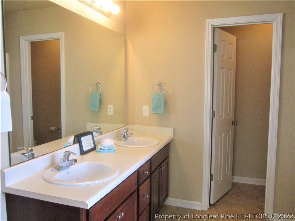 558 Cape Fear Road Raeford, NC 28376 - Photo 6 of 10 a bathroom with a sink and a mirror