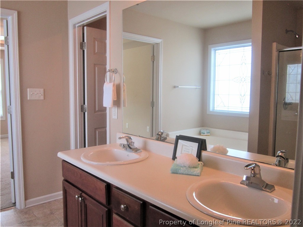 558 Cape Fear Road Raeford, NC 28376 - Photo 7 of 10 a bathroom with a sink and a mirror