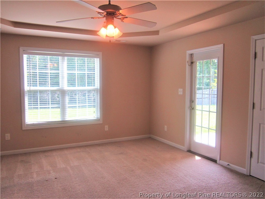 558 Cape Fear Road Raeford, NC 28376 - Photo 8 of 10 an empty room with a window and a fan