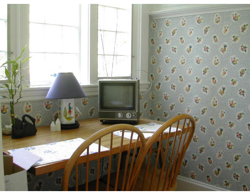36 Roslyn Road Newton, MA 02468 - Photo 9 of 9 a bedroom with furniture and a fireplace