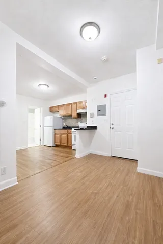 a view of kitchen with wooden floor