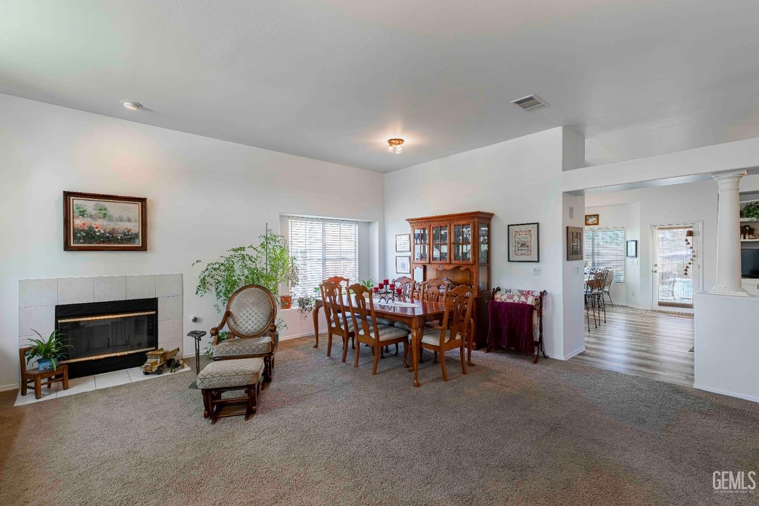 Undisclosed Address Bakersfield, CA 93312 - Photo 14 of 43 a living room with furniture and a fireplace