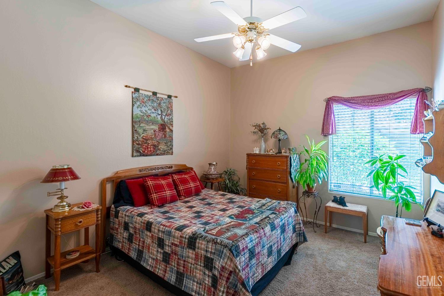 Undisclosed Address Bakersfield, CA 93312 - Photo 29 of 43 a bedroom with a bed and a chandelier