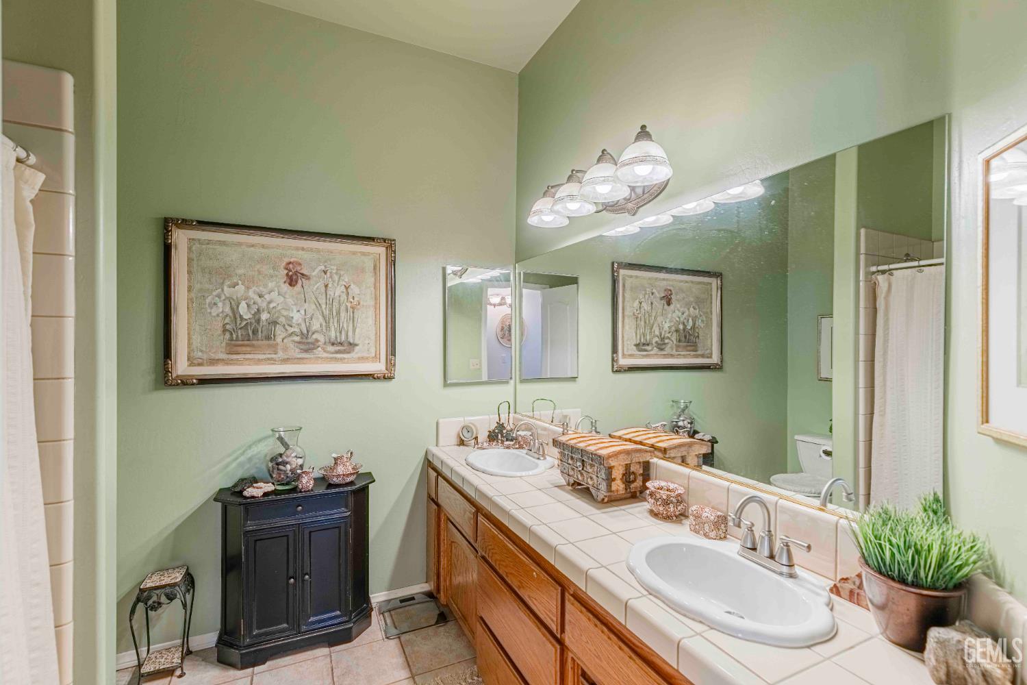 Undisclosed Address Bakersfield, CA 93312 - Photo 31 of 43 a bathroom with a sink vanity and a mirror