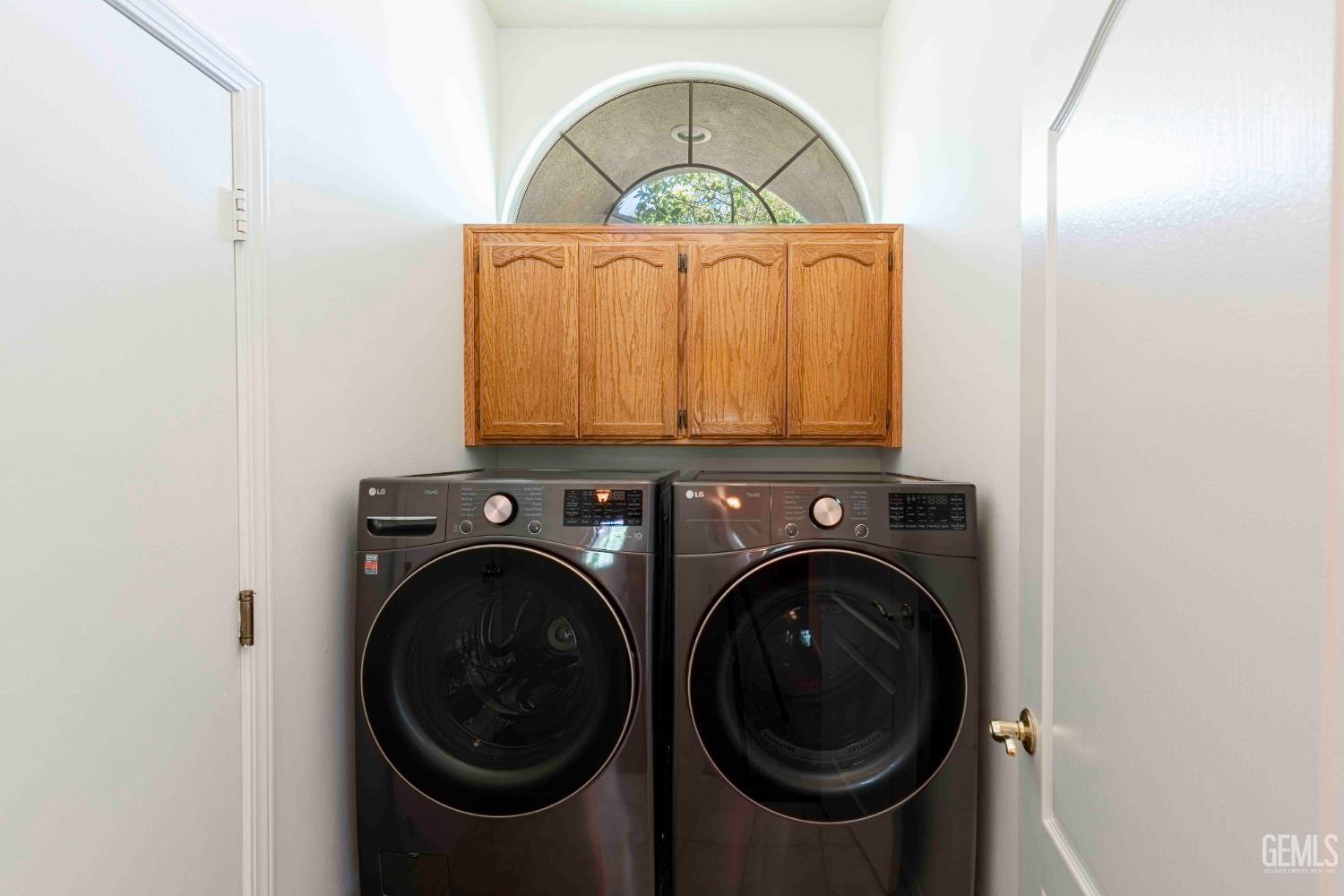 Undisclosed Address Bakersfield, CA 93312 - Photo 32 of 43 a close view of a utility room with washer and dryer