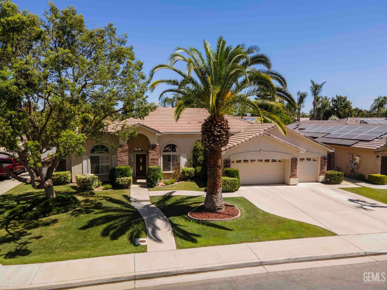 Undisclosed Address Bakersfield, CA 93312 - Photo 40 of 43 a front view of a house with garden