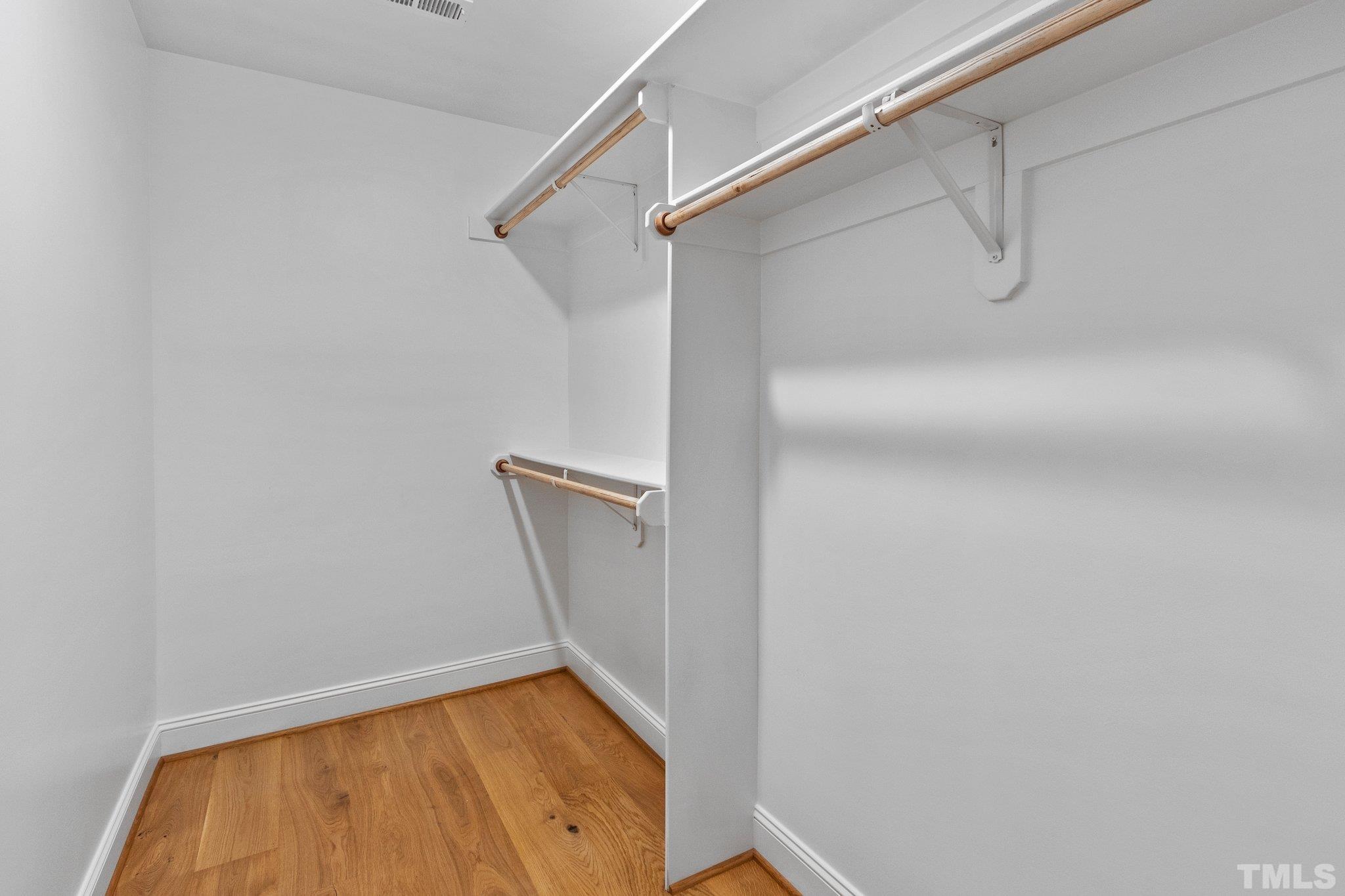 13304 Cleveland Road Garner, NC 27529 - Photo 54 of 61 a view of walk in closet with empty racks