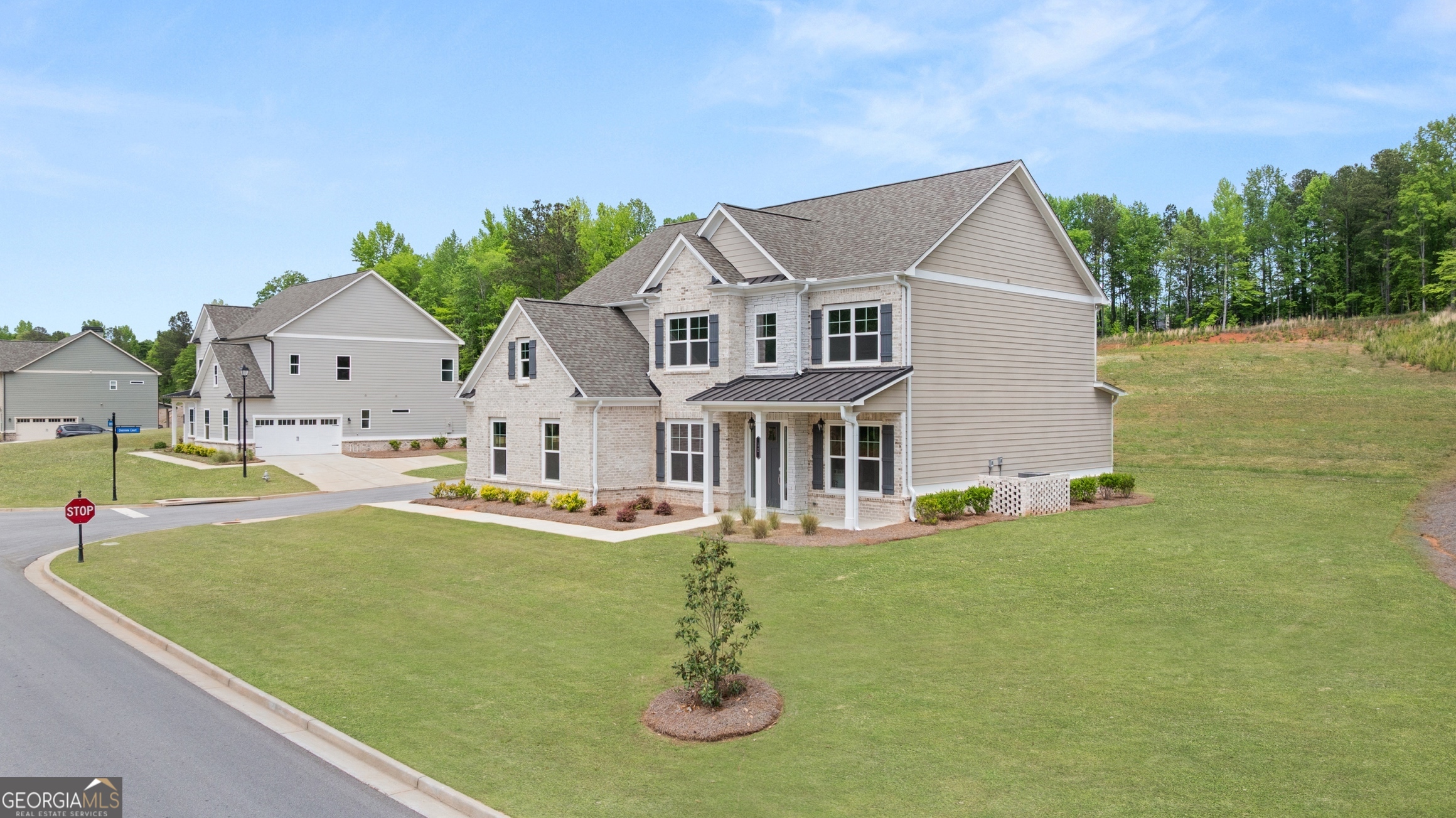 12 Overview Court Hoschton, GA 30548 - Photo 23 of 57 a front view of a house with garden