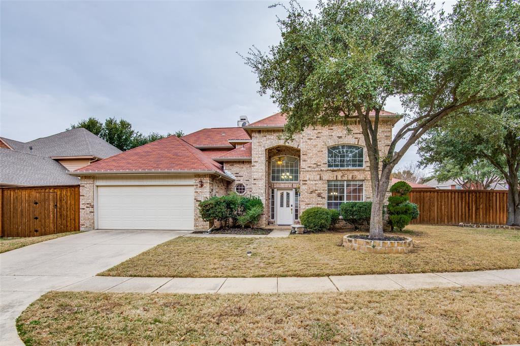 401 Rembert Court Highland Village, TX 75077 - Photo 1 of 1 a front view of a house with a yard and potted plants