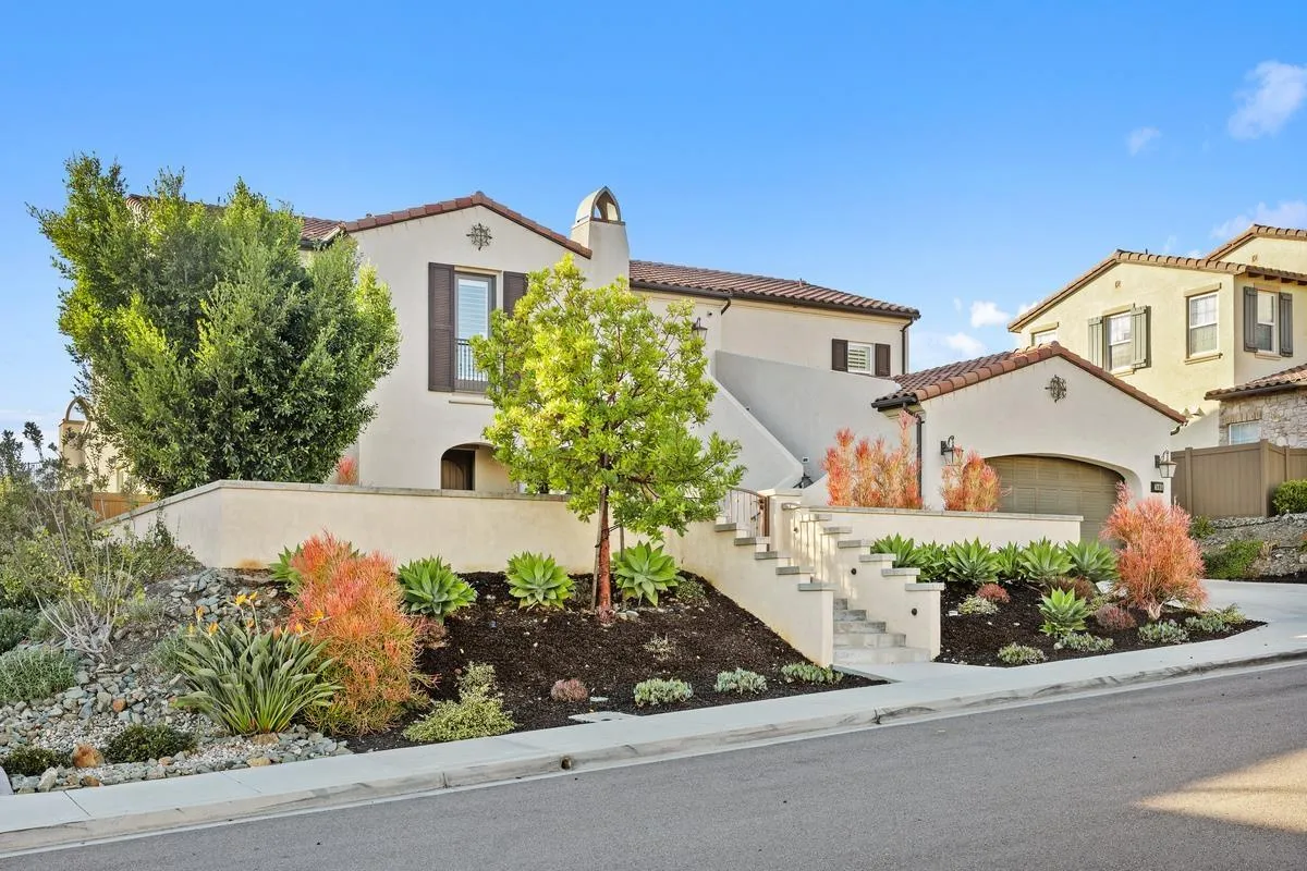 7495 Paseo Cristal Carlsbad, CA 92009 - Photo 12 of 75 front view of a house with a yard