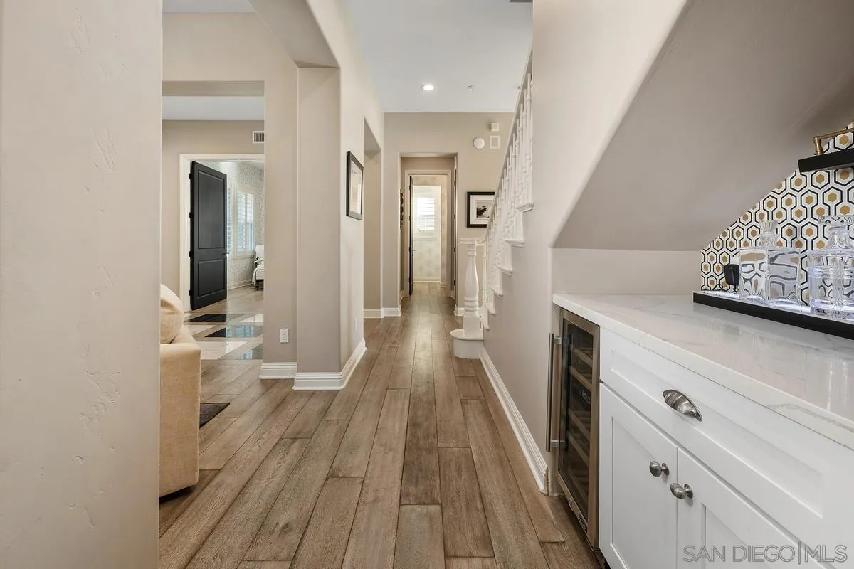 7495 Paseo Cristal Carlsbad, CA 92009 - Photo 20 of 75 a view of a hallway with wooden floor and staircase