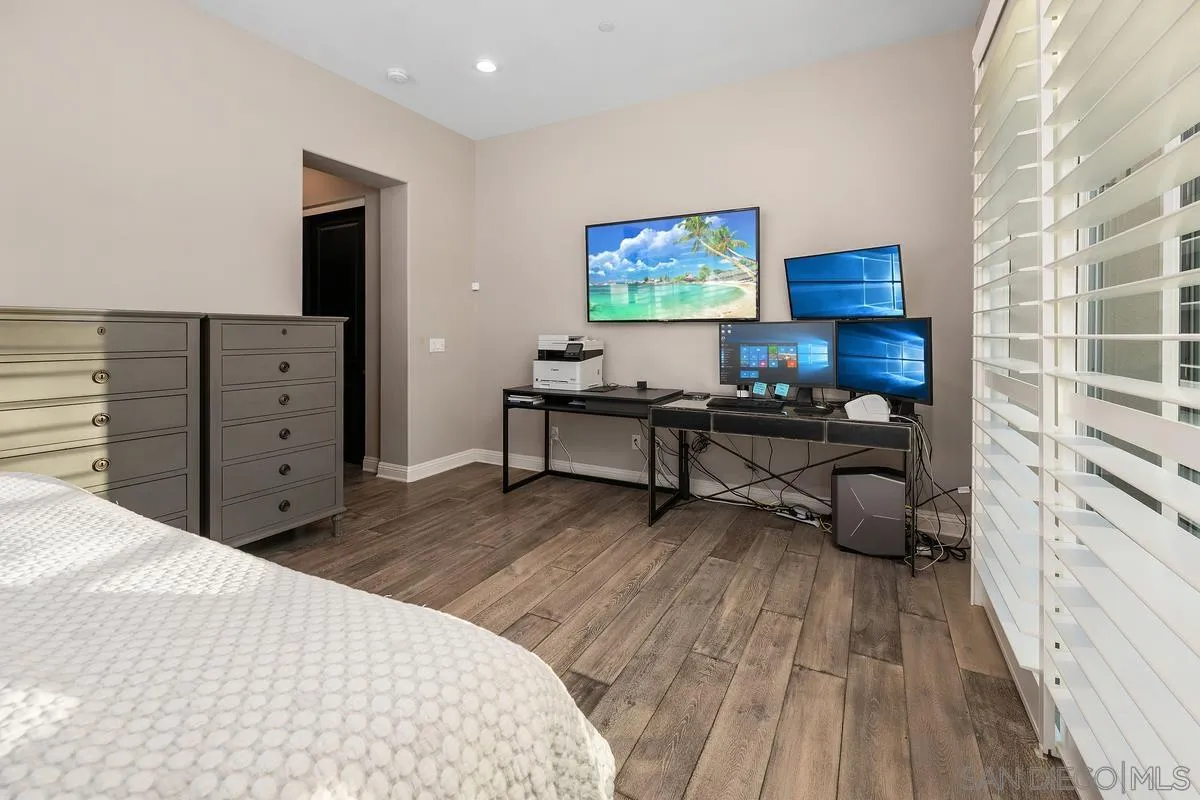 7495 Paseo Cristal Carlsbad, CA 92009 - Photo 33 of 75 a bed room with a bed and a television