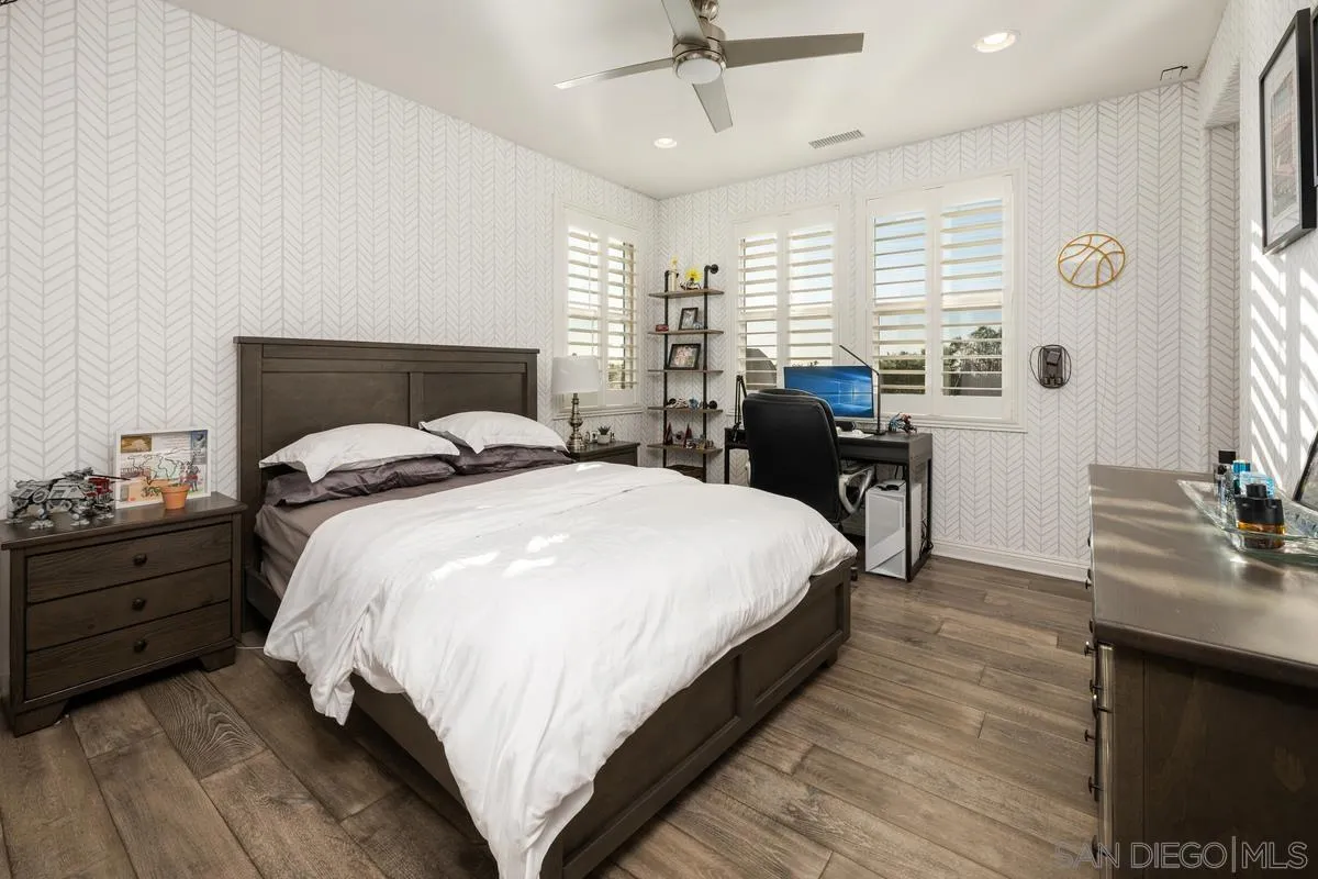 7495 Paseo Cristal Carlsbad, CA 92009 - Photo 45 of 75 a bedroom with a bed and window