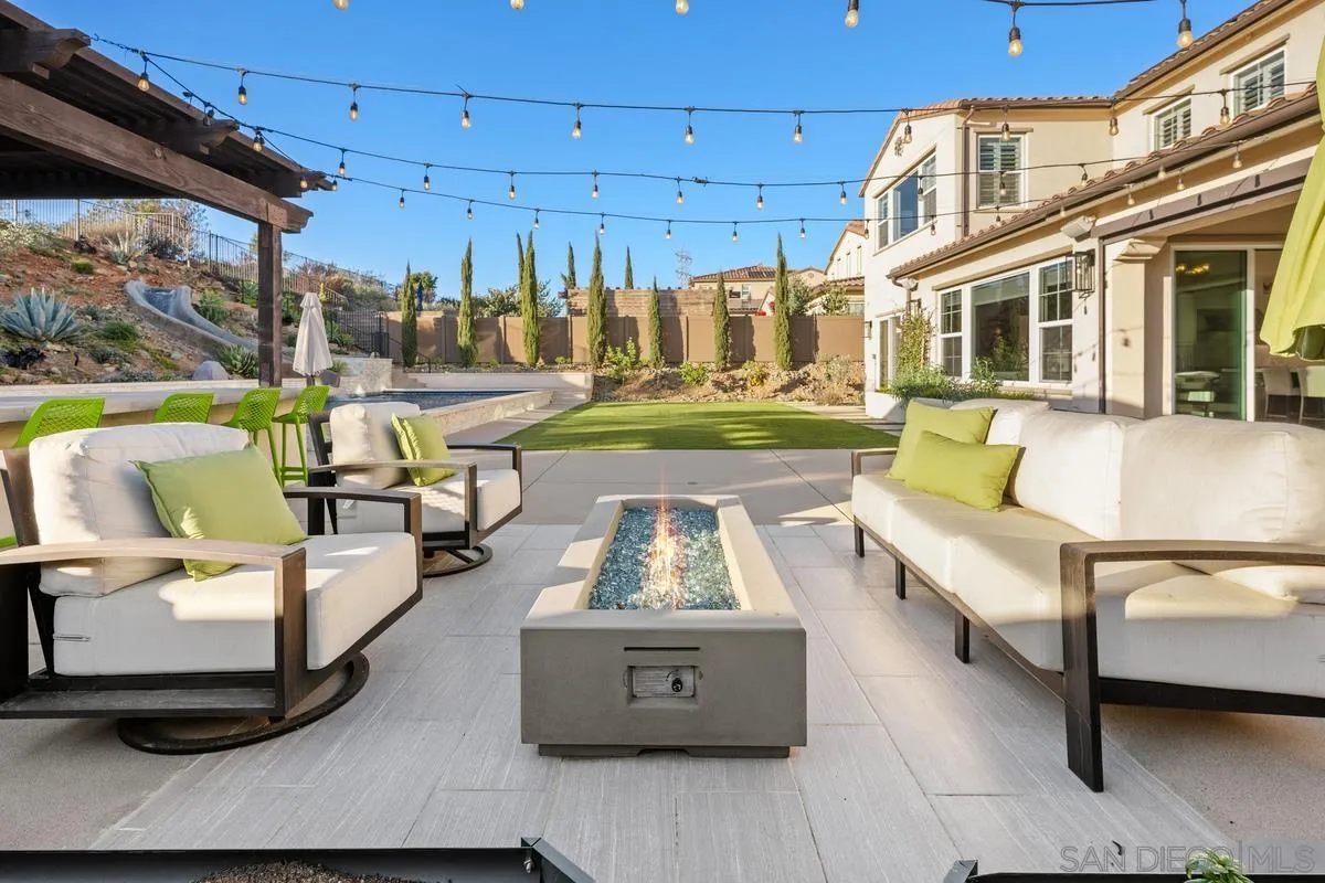7495 Paseo Cristal Carlsbad, CA 92009 - Photo 53 of 75 a view of a patio with couches chairs and potted plants