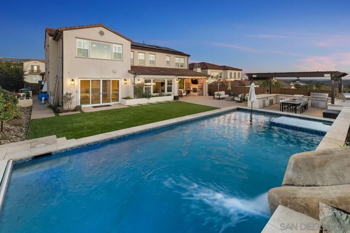 7495 Paseo Cristal Carlsbad, CA 92009 - Photo 6 of 75 a view of a building with a yard