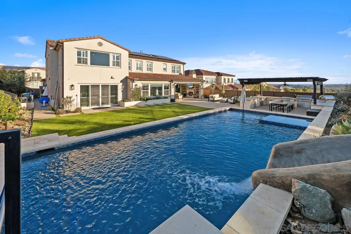7495 Paseo Cristal Carlsbad, CA 92009 - Photo 62 of 75 a view of a house with a yard