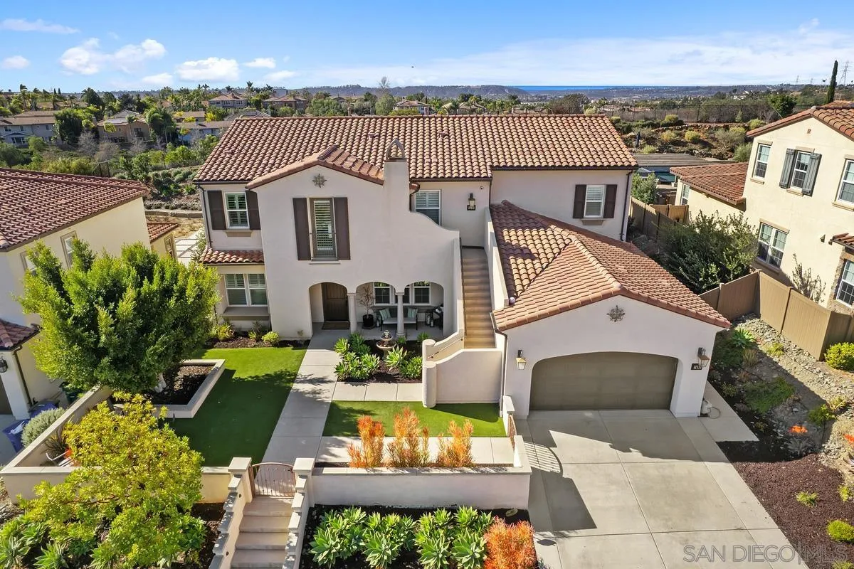 7495 Paseo Cristal Carlsbad, CA 92009 - Photo 69 of 75 a view of a patio with couches table and chairs with potted plants