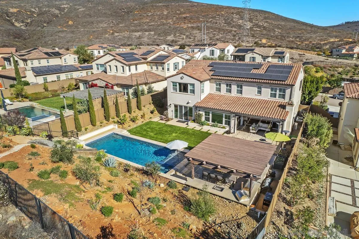 7495 Paseo Cristal Carlsbad, CA 92009 - Photo 74 of 75 an aerial view of a residential apartment building with a yard