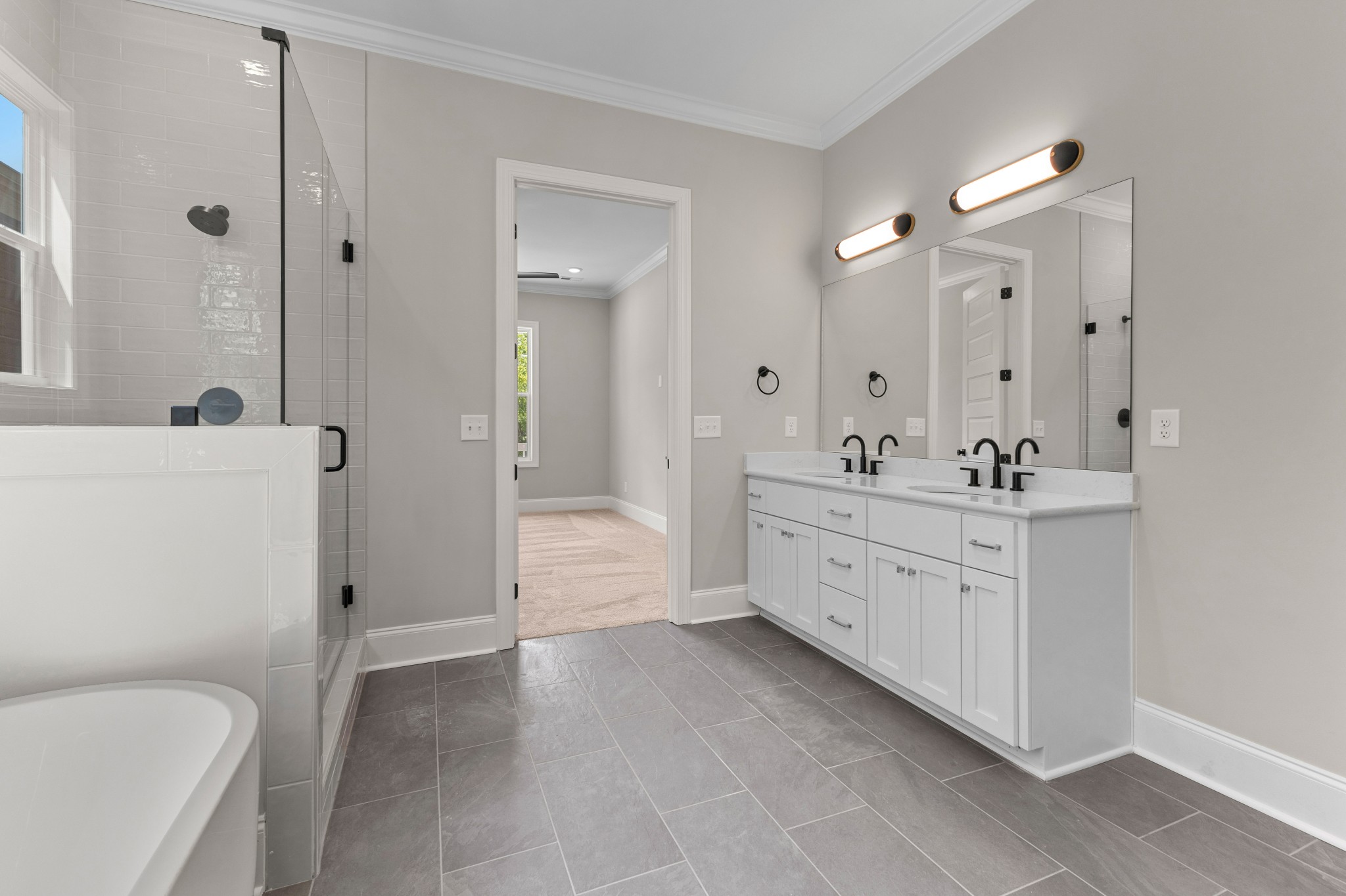 7131 Frances Street Fairview, TN 37062 - Photo 13 of 54 a spacious bathroom with a double vanity sink a mirror and a bathtub