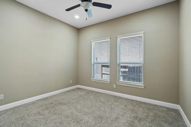 a bathroom with a sink a toilet a mirror and shower